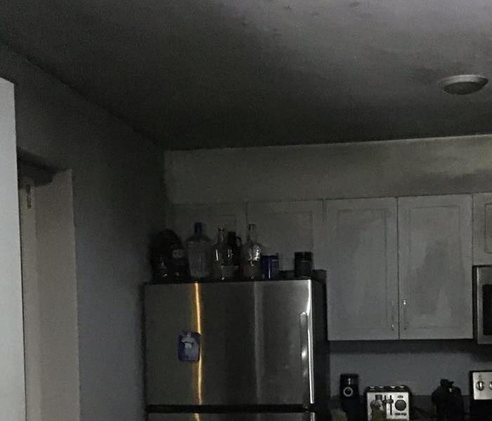Kitchen with black soot in the ceiling
