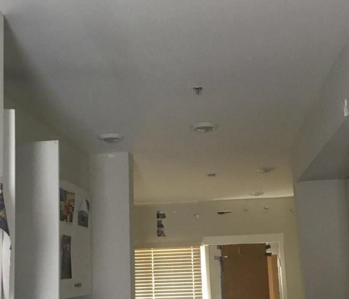 black soot in the top ceiling with kitchen equipment in the hall