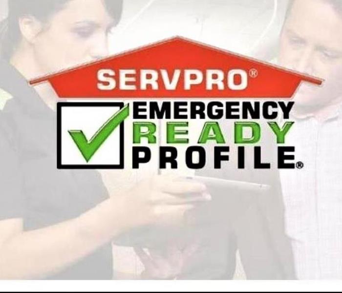 SERVPRO logo in the top middle section with a man and female in the background